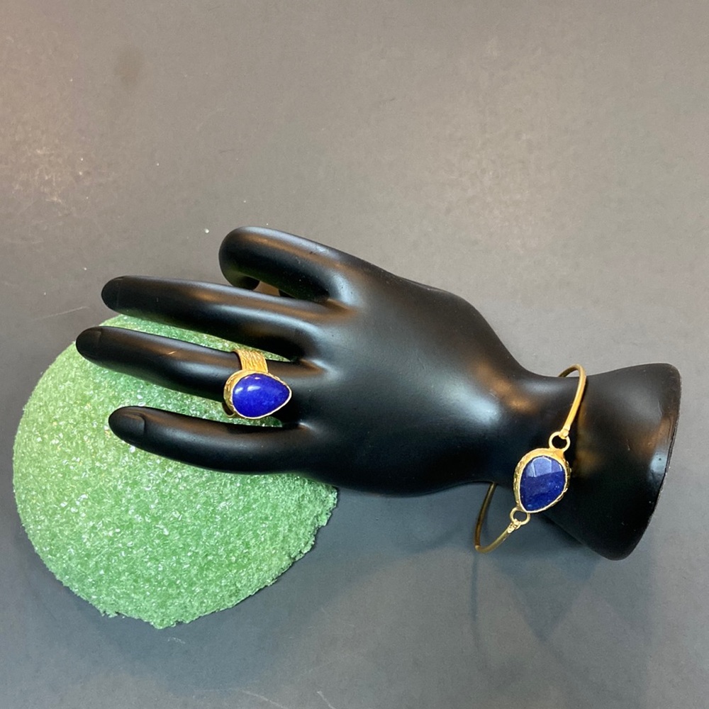 Matching Blue Stone on Gold Tone Metal Bracelet and ring.